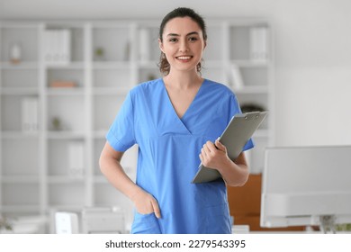 Female medical assistant with clipboard in clinic - Shutterstock ID 2279543395