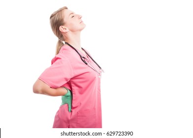 Female Medical Nurse Holding Her Back Like Hurting Isolated On White Background With Copy Text Space