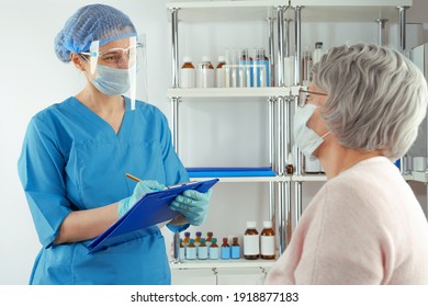 Female medical professional interviewing a senior lady adult woman. Hospital healthcare case - Shutterstock ID 1918877183