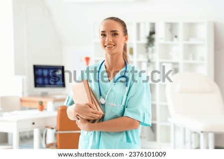 Female medical student with books at university