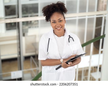 Female Medical Student, Doctor In Uniform Holding Clipboard Working In Hospital. Portrait Of Woman Health Care Nurse With Stethoscope Works In Clinic. Healthcare And Medicine Professional Occupation.