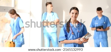 Female medical student in hall of clinic