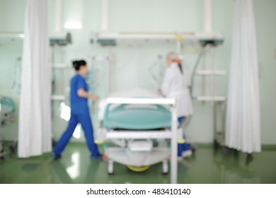 Female Medical Workers At The Patient Bedside In ICU.