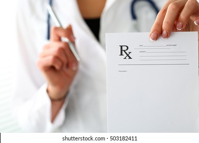 Female Medicine Doctor Hand Hold Clipboard Pad And Give Prescription To Patient Closeup. Panacea, Life Save, Prescribe Treatment, Legal Drug Store, Contraception Concept. Empty Form 