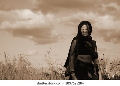 A Female Militia Soldier In A Post Apocalyptic Desert Wasteland. Urban Combat And Wasteland 