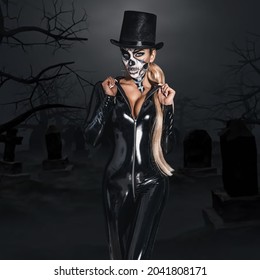 Female Model In Halloween. Sexy Woman In Top Hat And Skull Make Up. Halloween Costume Concept.