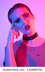 Female Model In Studio, Coloured Gel Lighting, Photography Lighting Technique. Gels And Color. Short Hair And Chocker, Edgy Alternative Fashio Look