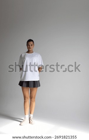 female model in studio pose, fulllength female model displaying activewear confidently in studio