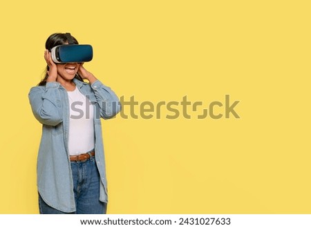 female in modern VR headset   exploring virtual reality universe on yellow background