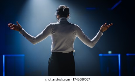 Female Motivational Speaker On Stage, Talking About Happiness, Diversity, Success, Leadership, STEM And How To Be Productive. Woman Presenter Leads Tech Business Conference.