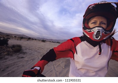 Female Motocross Racer On Her Motorcycle