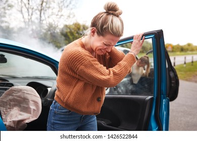 Female Motorist In Crash For Crash Insurance Fraud Getting Out Of Car - Shutterstock ID 1426522844