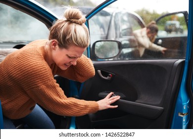 Female Motorist In Crash For Crash Insurance Fraud Getting Out Of Car - Shutterstock ID 1426522847