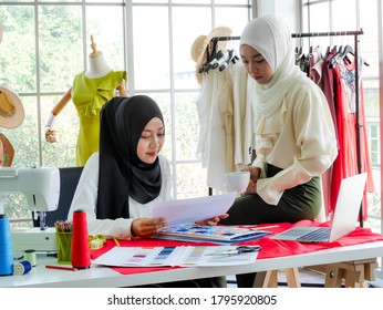 Female Muslim Fashion Designers Wearing HIJAB Work On Creative Dress Project. New Normal Social Distancing Concept. 