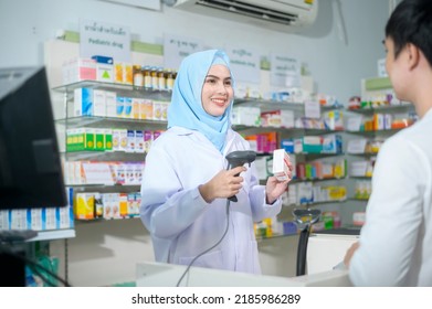 A Female muslim pharmacist counseling customer about drugs usage in a modern pharmacy drugstore. - Powered by Shutterstock