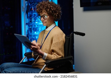 Female network engineer in wheelchair using tablet pc - Powered by Shutterstock