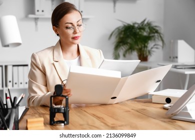 Female Notary Public Working In Office