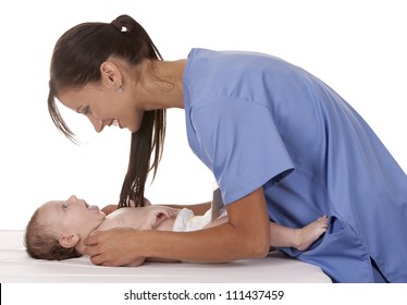 female nurse checking baby on white isolated background