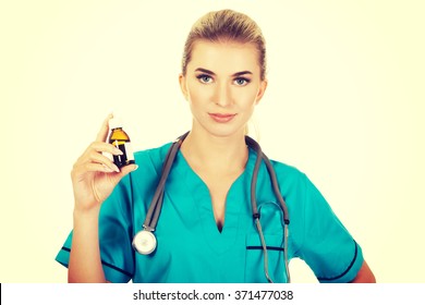 Female Nurse Or Doctor Holding Medicine Bottle In The Hand