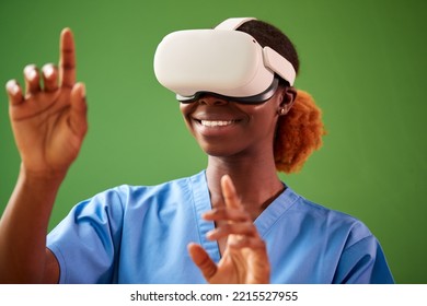 Female Nurse Or Doctor In Scrubs With VR Headset Interacting With AR Technology Against Green Screen - Powered by Shutterstock