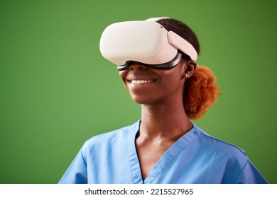 Female Nurse Or Doctor In Scrubs With VR Headset Interacting With AR Technology Against Green Screen - Powered by Shutterstock