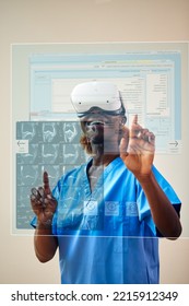 Female Nurse Or Doctor In Scrubs With VR Headset Interacting With AR Technology On Projected Screen