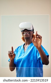 Female Nurse Or Doctor In Scrubs With VR Headset Interacting With AR Technology On Projected Screen