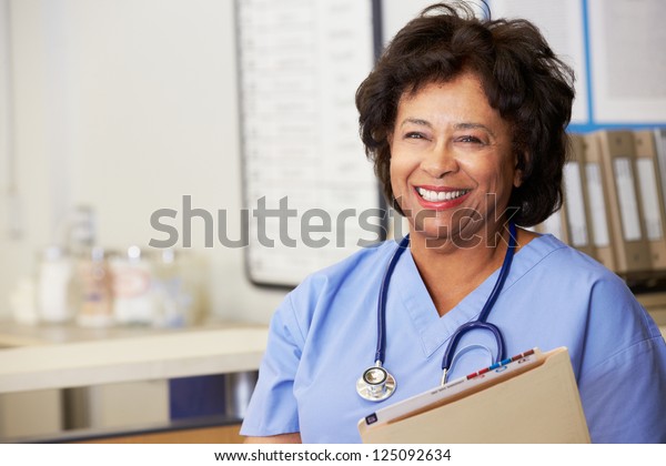 Female Nurse At Nurses\
Station