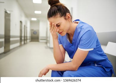 Female nurse suffering from headache 