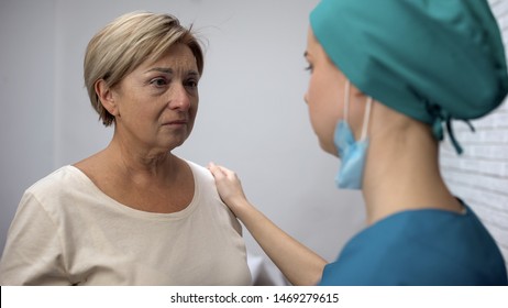 Female Nurse Telling Patient Bad Diagnosis, Disappointing News, Woman Crying