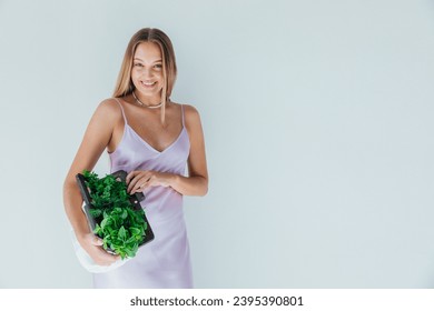 Female nutritionist holding bag with vegetables for eating - Shutterstock ID 2395390801