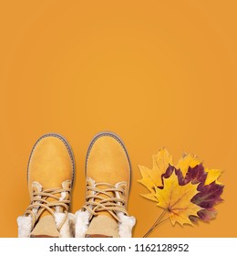 Female orange fashion shoes boots with autumn leaves on orange background top view flat lay. Fashion Lady Footwear Set Trendy Autumn accessories Female fashion look - Shutterstock ID 1162128952