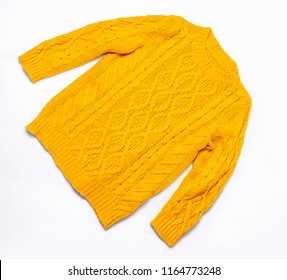 Female orange knitted sweater on white background top view flat lay. Fashion Lady Clothes Set Trendy Cozy Knit Jumper Autumn accessories. Female fashion look - Shutterstock ID 1164773248