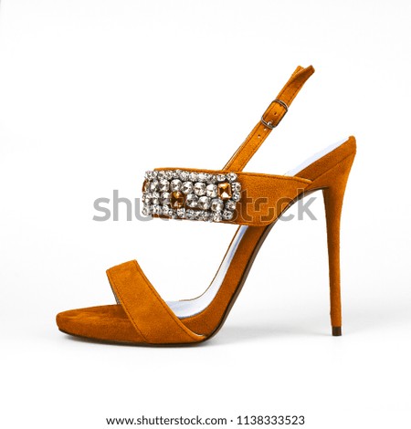 female orange shoes over white 