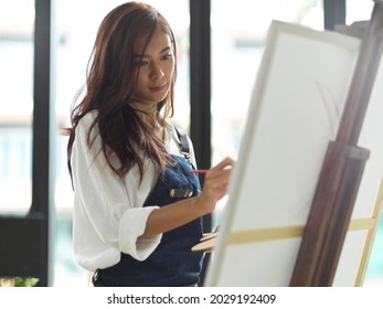 Female Painter Painting Artwork On Canvas Easel, Attractive Female Artist, Creative Person