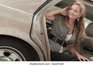 Female Passenger Getting Out Of Her Car