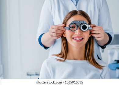 Female patient checking vision in ophthalmological clinic