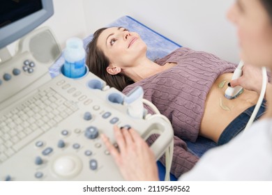 Female Patient Getting Abdominal Ultrasonography In Clinic