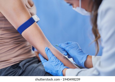 Female Patient Having Blood Sample Drawn In A Lab