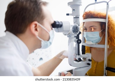 A Female Patient And Her Doctor During An Eye Examination In A Professional Eye Clinic