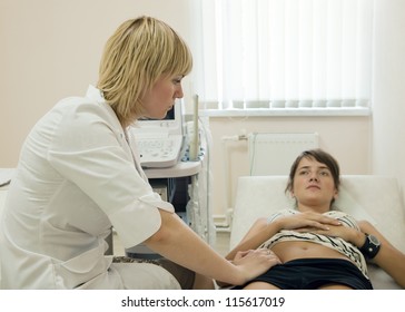 Female Patient Laying Down On Couch During Medical Examination