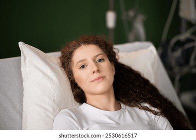 Female patient lies in her hospital bed, gazing out the window, lost in deep thoughts about life beyond the medical setting. - Powered by Shutterstock