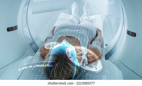 Female Patient Lying on CT or PET or MRI Scan Bed, Moving Inside the Machine While it Scans Her Brain and Vital Parameters. Augmented Reality VFX In Hospital Medical Lab with High-Tech Equipment.