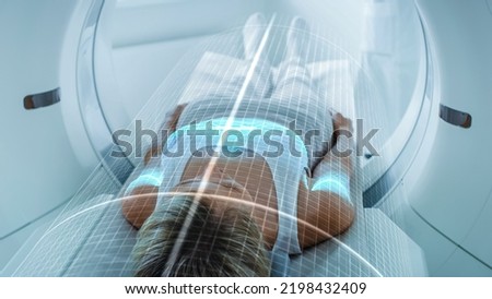 Female Patient Lying on CT or PET or MRI Scan Bed, Moving Inside the Machine While it Scans Her Brain and Body. Augmented Reality Concept with Visual Effects In Hospital Lab with High-Tech Equipment.