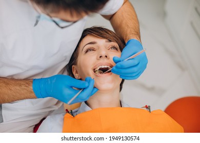 Female patient making teeth check up at dentist - Powered by Shutterstock