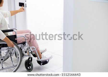 Similar – Senior woman in a wheelchair alone