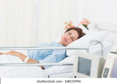 Female Patient Sleeping In Medical Bed At The Hospital Ward