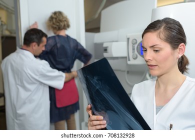 Female Patient Standing For An Xray Exam