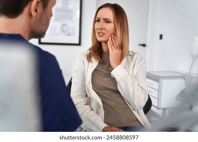 Female patient talking about the toothache - Powered by Shutterstock