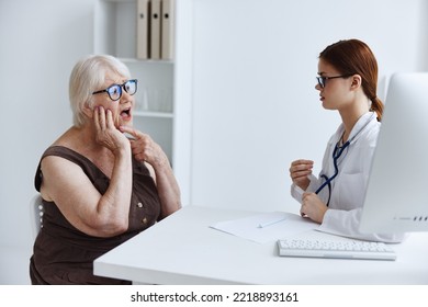Female Patient Talking To A Doctor Medical Office